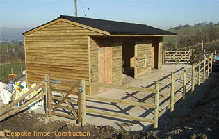 L-Shaped stable with horizontal cladding